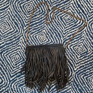 Faux-leather fringe crossbody bag.